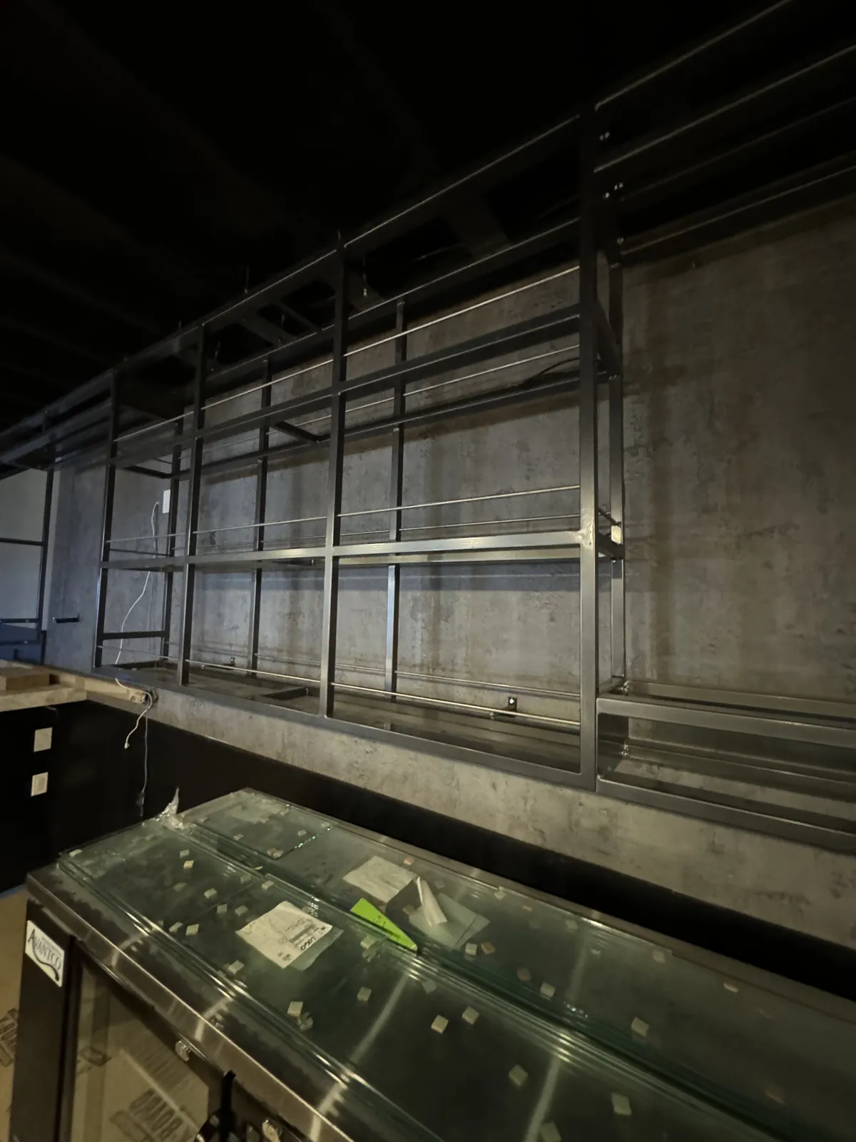 Back-bar shelving before the LED lighting was installed